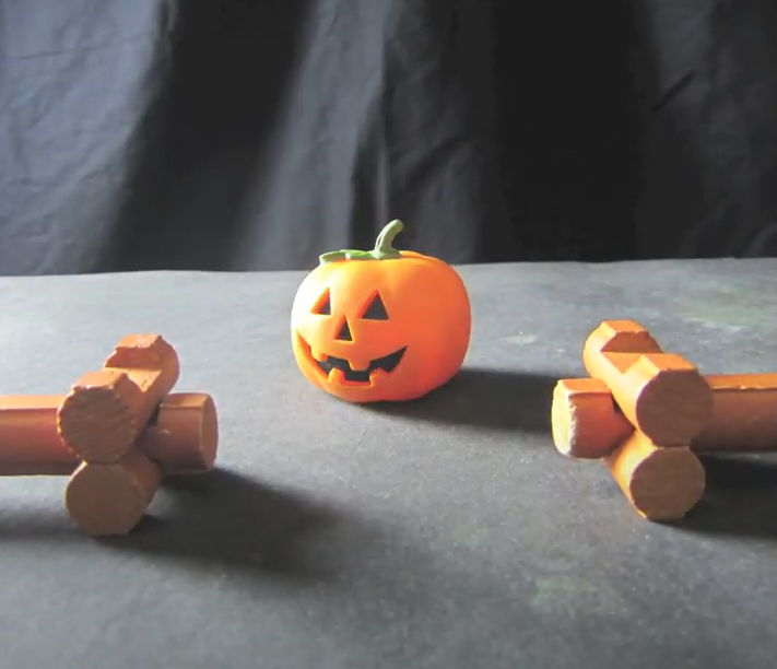 Lincoln logs with jack-o-lantern