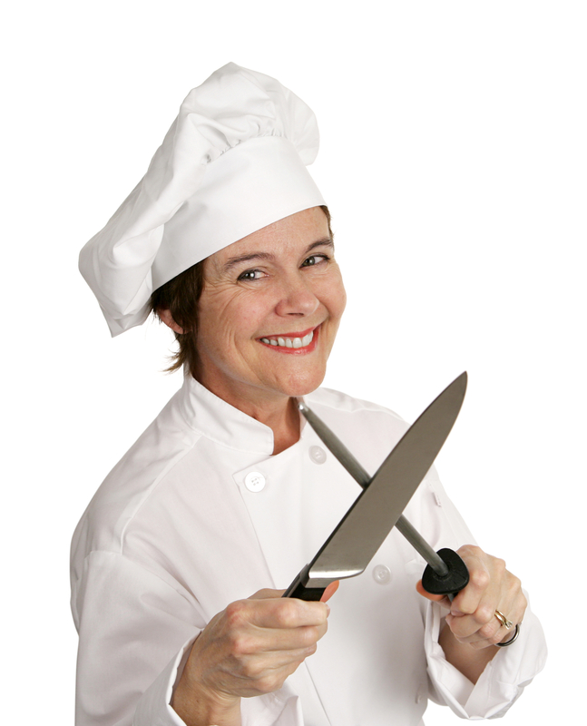 woman chef sharpening knife