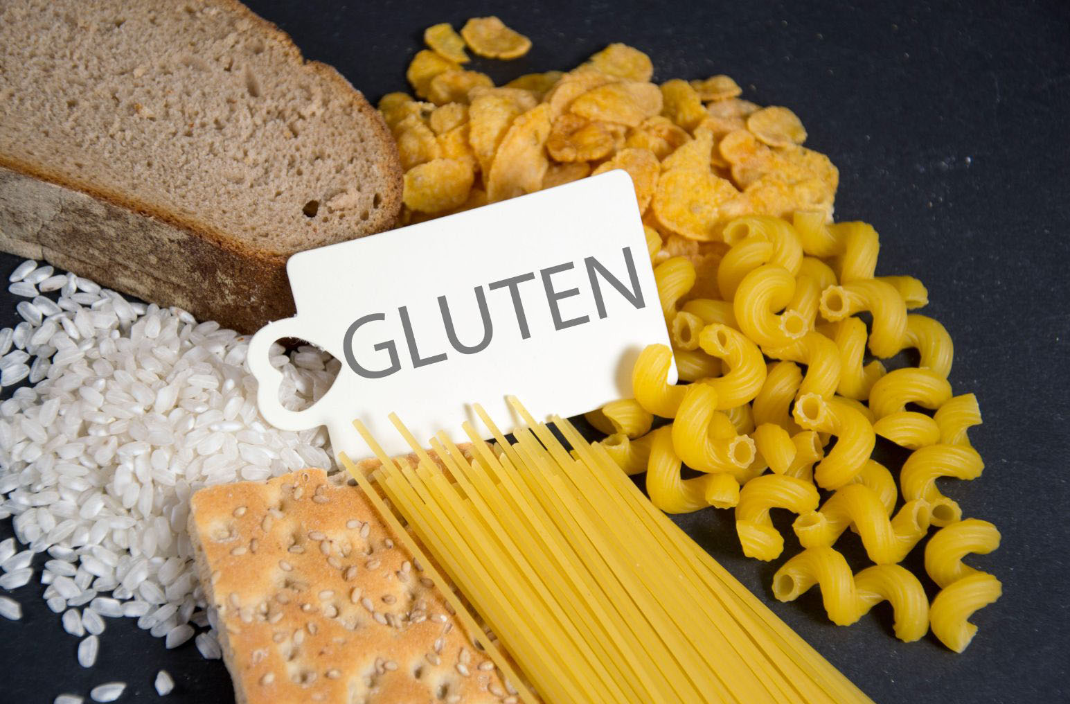 pasta, bread and crackers with gluten sign