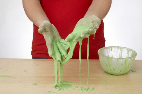 hands covered in home made slime