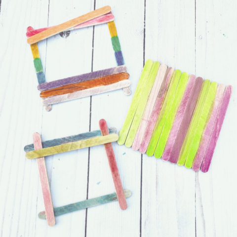 3 colorful picture frames made out of popsicle sticks