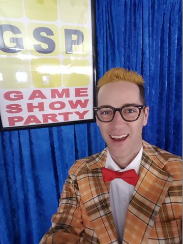 game show host with loud jacket and bow tie