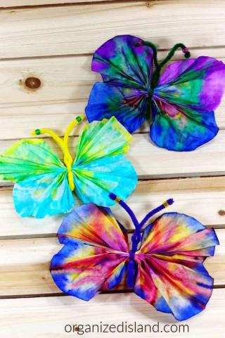 colorful watercolor butterflies made from coffee filters and pipe cleaners