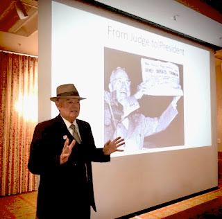 Bill Nicks portraying Tom Pendergast with image of Truman winning presidency