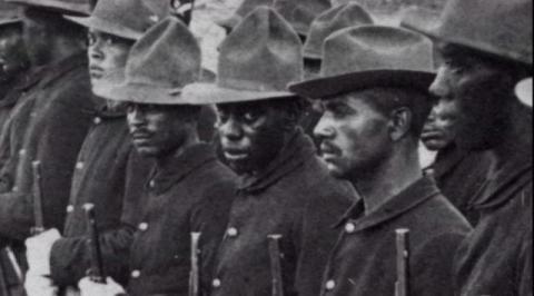 image of Buffalo Soldiers in line looking unhappy