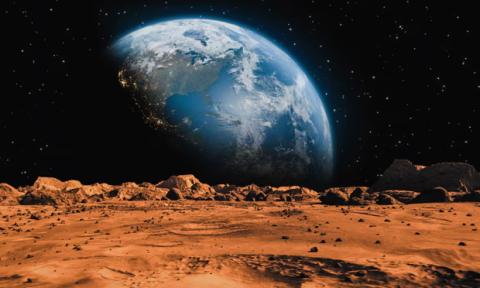 image of the Earth in space, with the dry, red landscape of Mars in foreground.