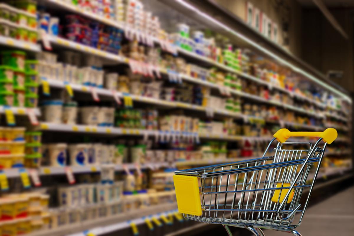 grocery cart in supermarket aisle