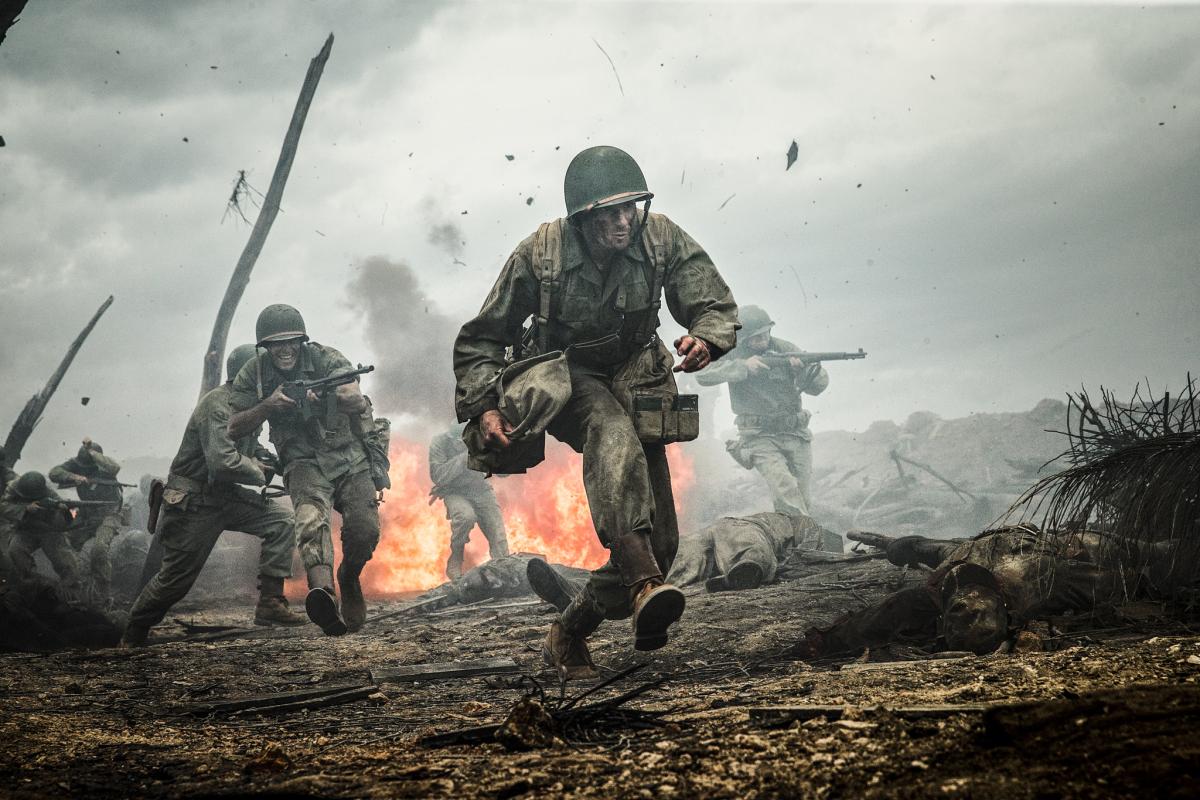 soldiers running through battlefield