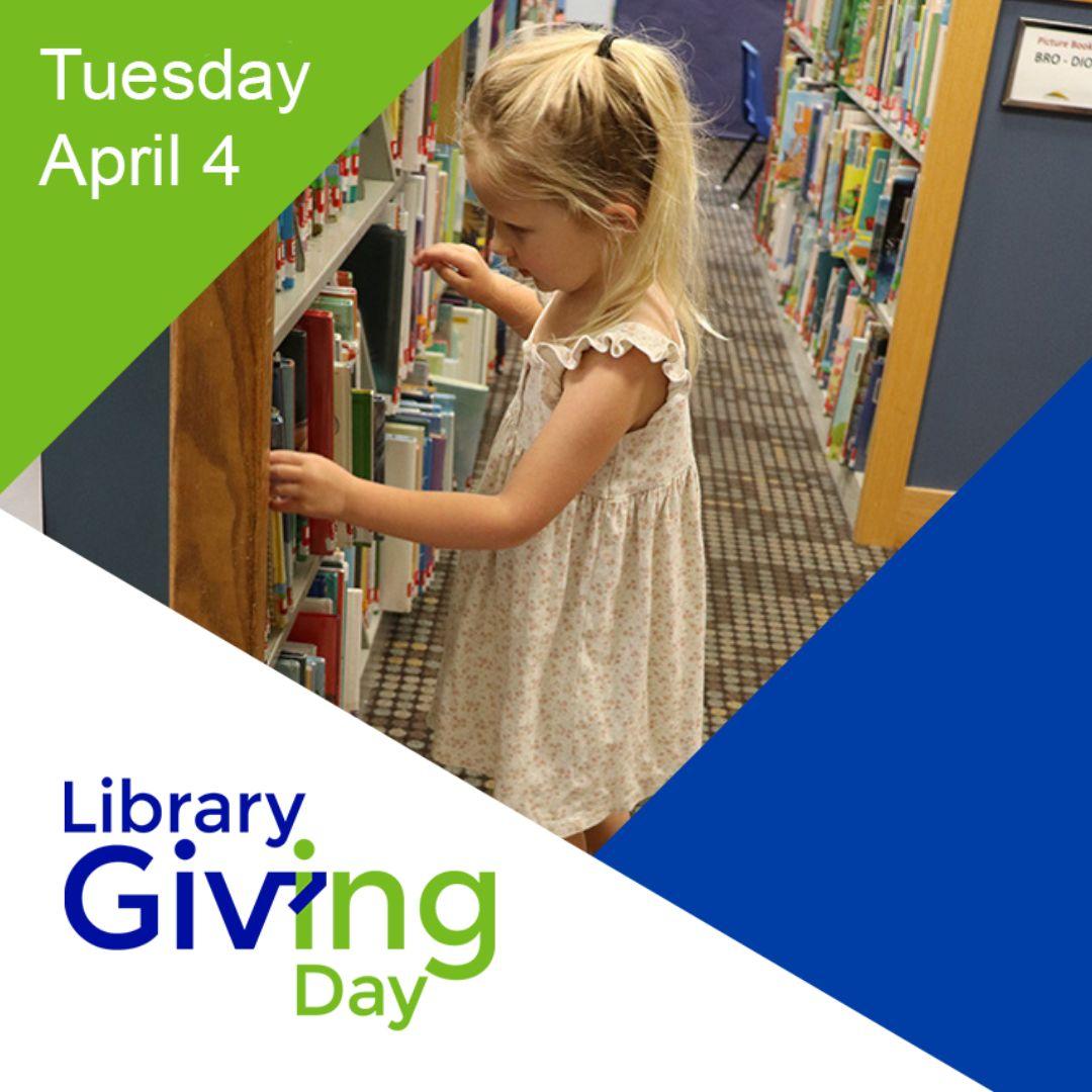 Little girl looking at library books