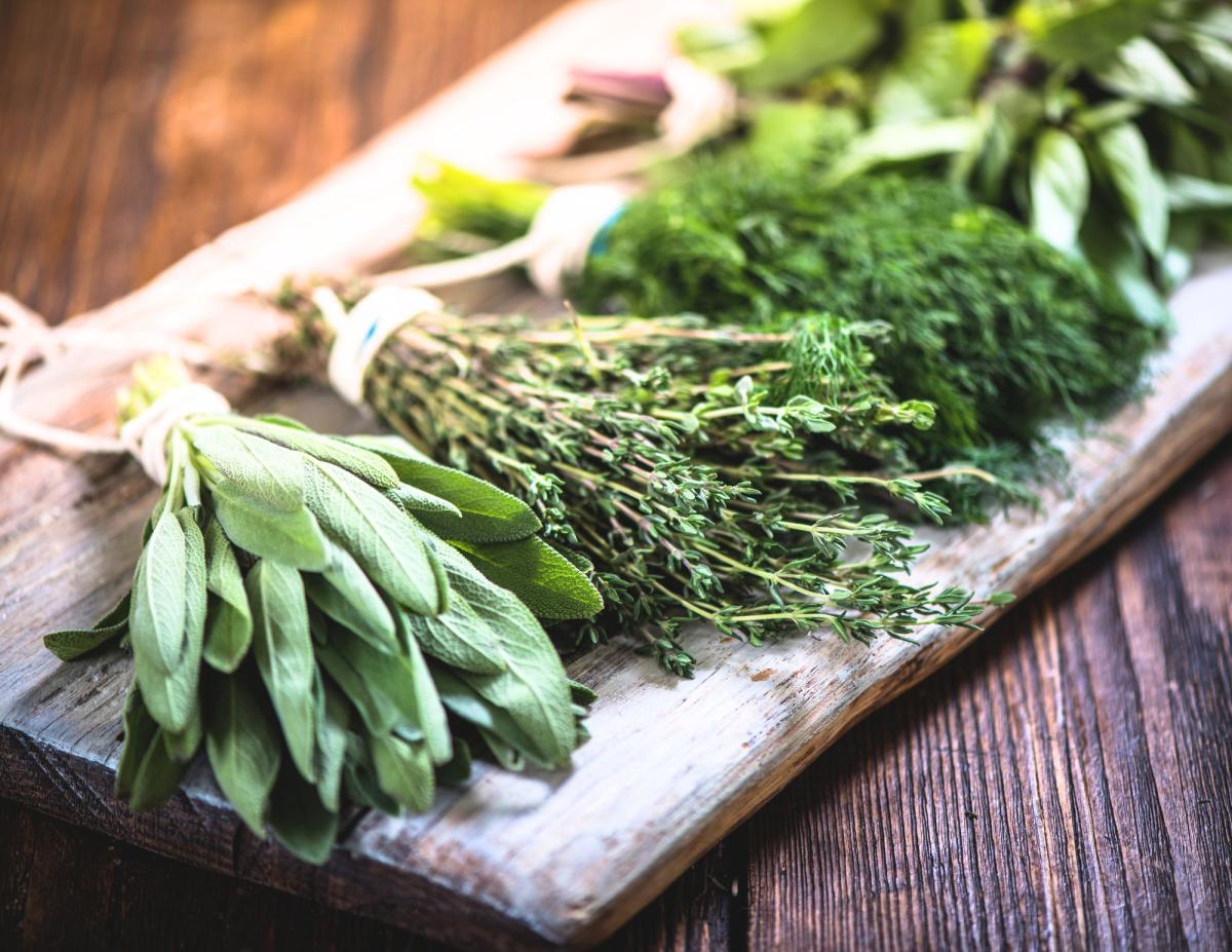 fresh herbs on a cutting board