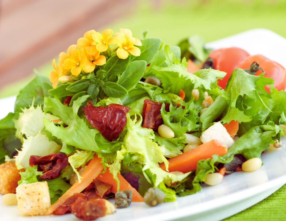 fresh salad with flower garnish