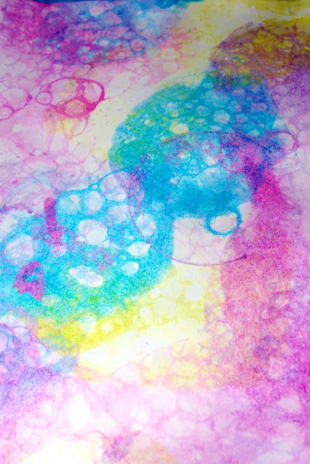 colored circular painting made from bubbles