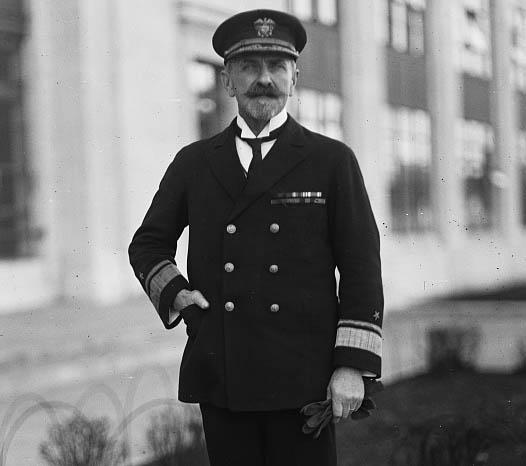 Lt. Commander Newton McCully standing in uniform