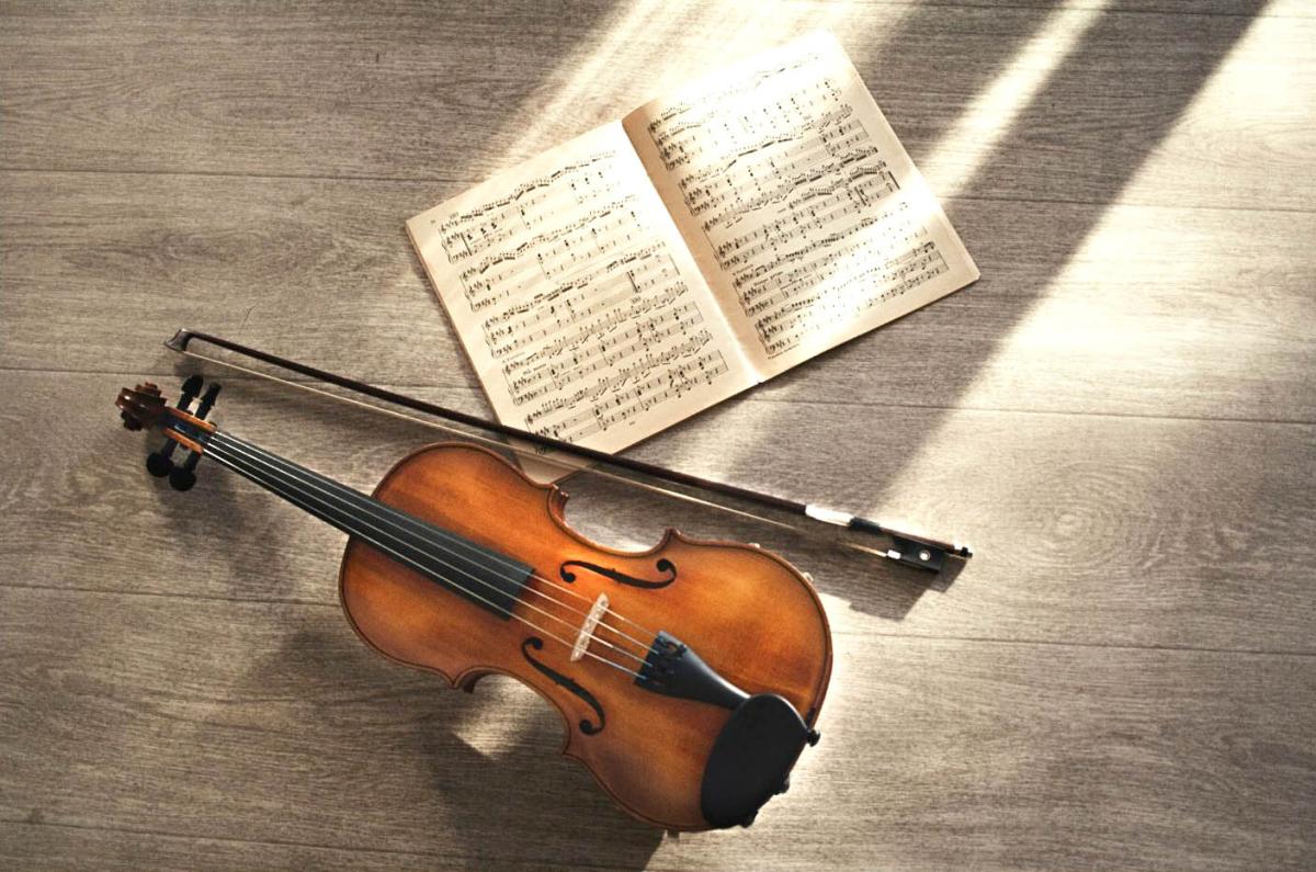 violin and bow with sheet music